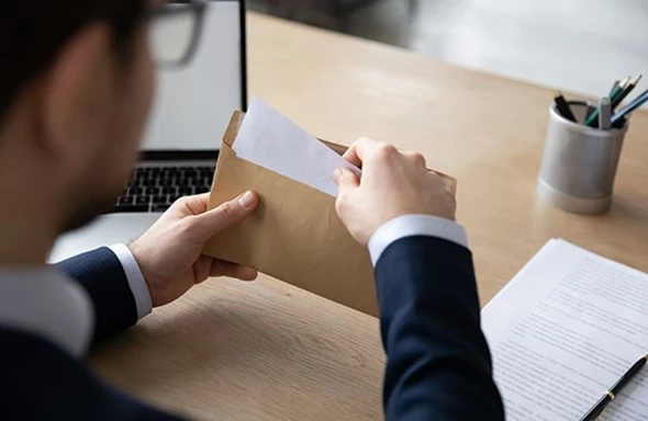 Man opening an envelope